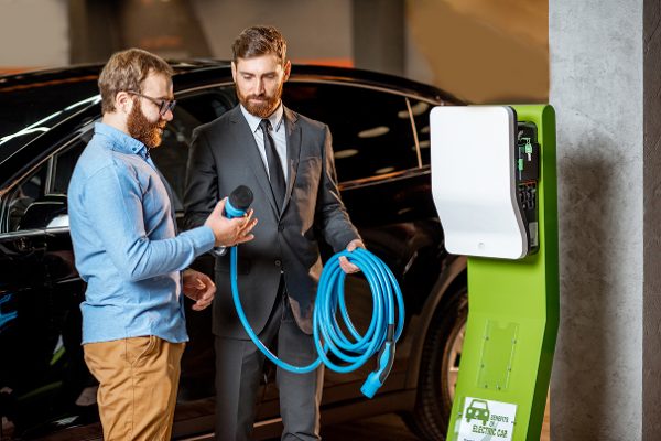 customer-with-a-seller-at-the-showroom-with-car-ch-2025-03-15-04-45-18-utc (1)